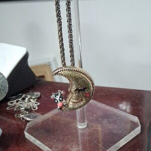 Gold and Black Crescent Moon Necklace with Textured Design
